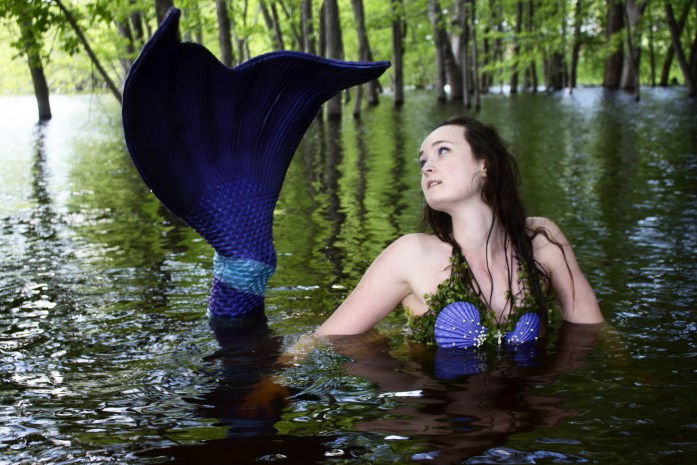 Mermaid poses in the St. Croix River.
